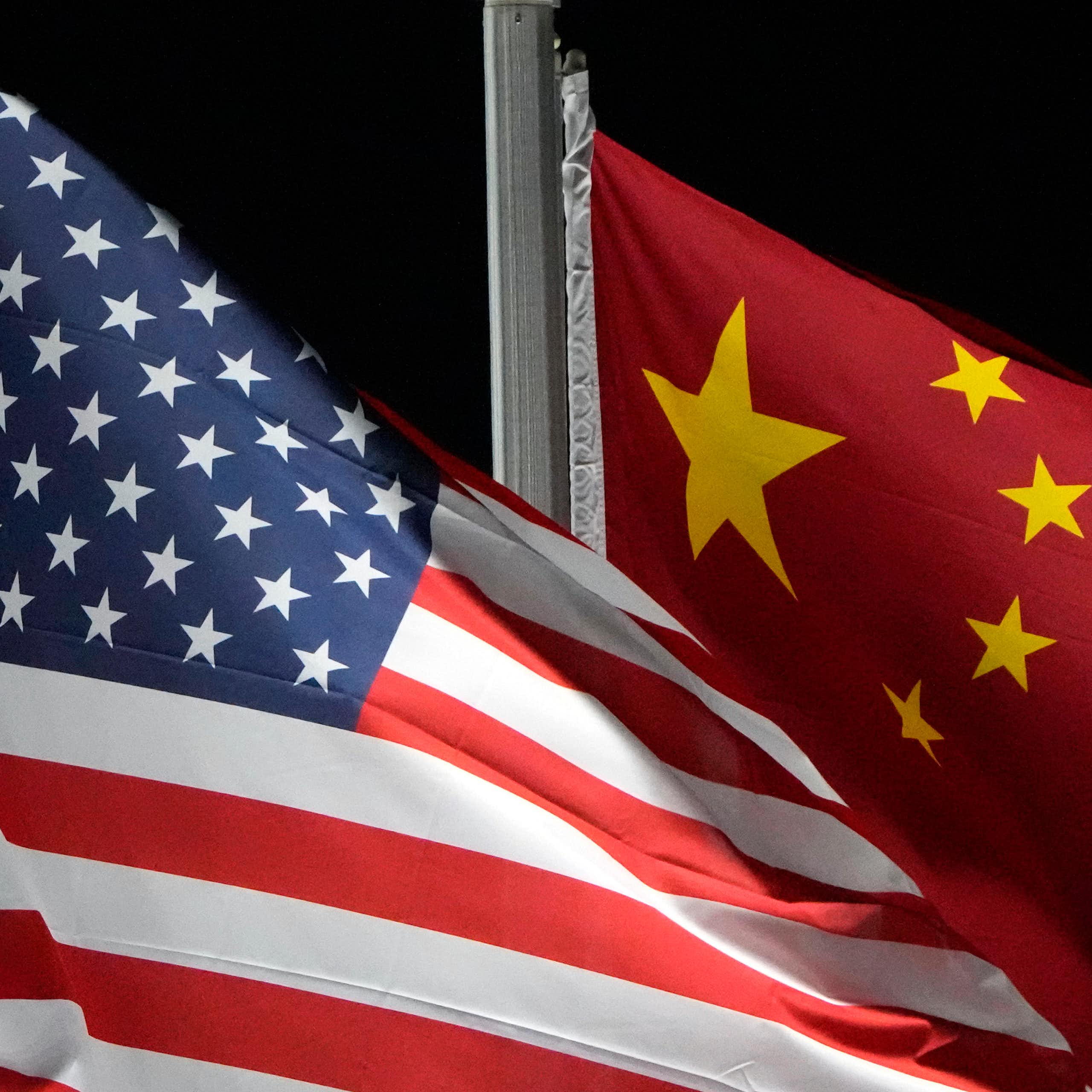 the US and People's Republic of China flags